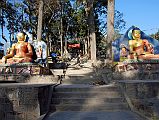 
Kathmandu Swayambhunath Two Buddha Statues At Entrance Gate
